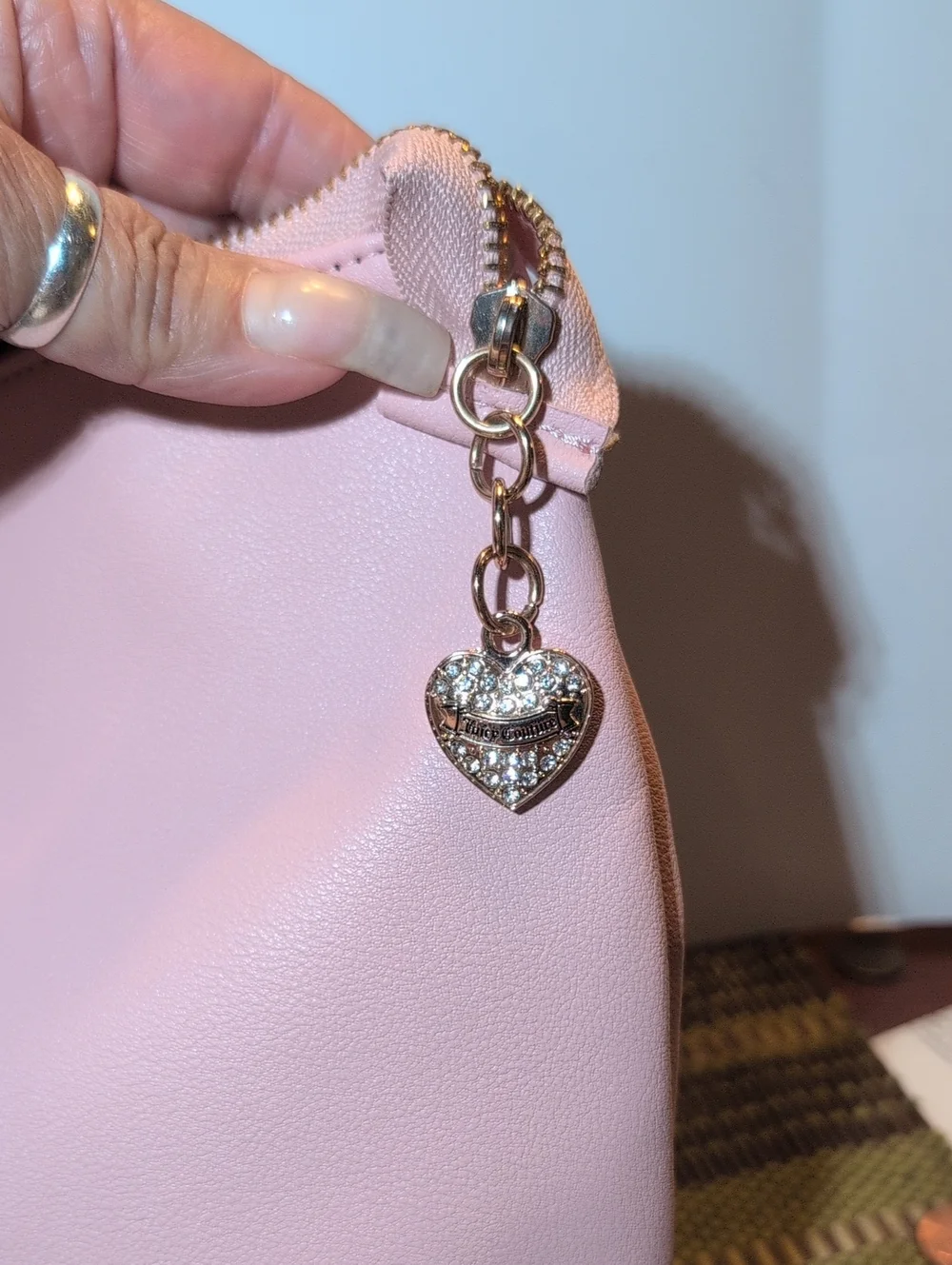 Juicy Couture Light Pink Vegan Leather Clutch Bag With Gold Hardware.